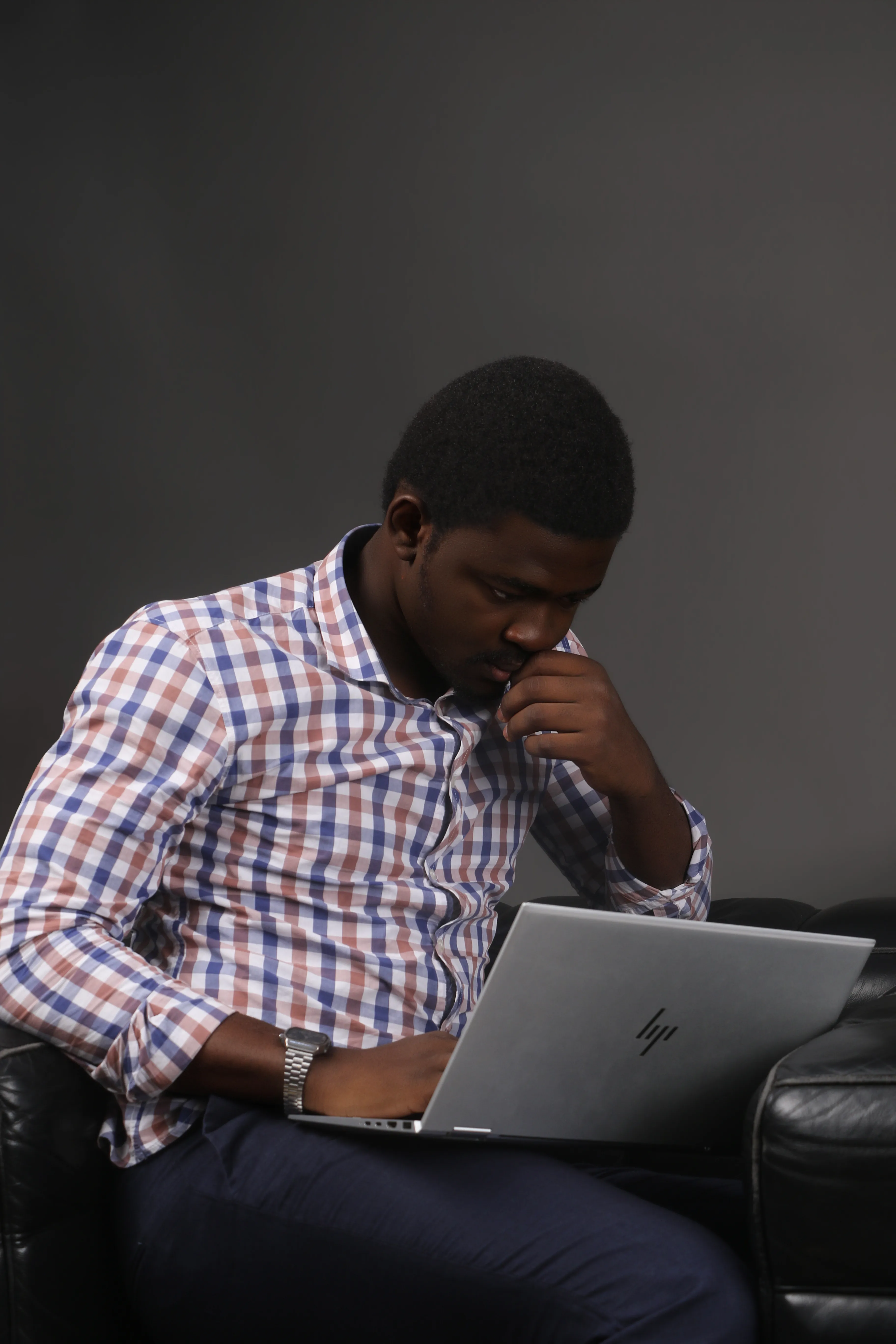 Samuel Odifa working at his laptop